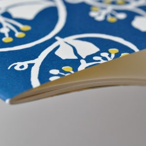 detail of Exercise Book with Deep Marine Blue and Acid Yellow patterned cover