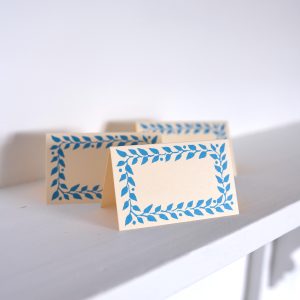 place cards with bright blue border