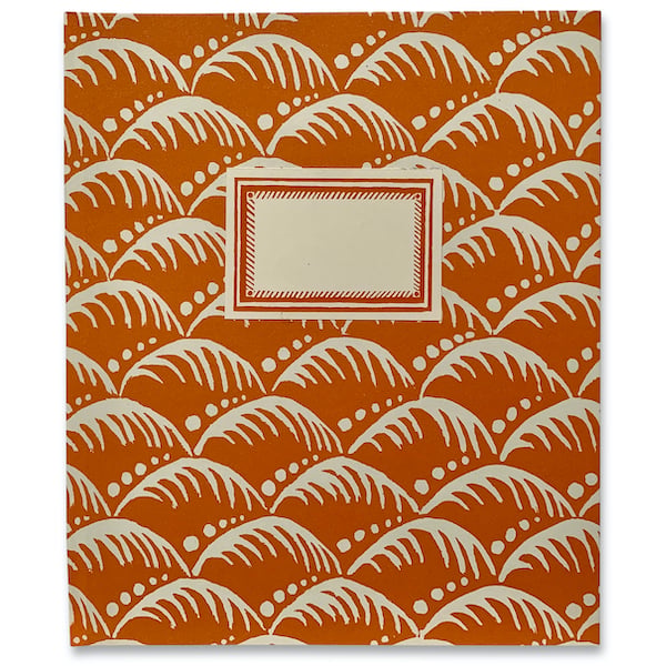 An orange hardback notebook with Wave pattern