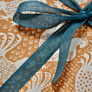 Parcel wrapped in Hens Cinnamon paper by Cambridge Imprint