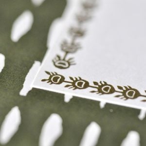 Closeup on Cambridge Imprint Long Labels in Dark Olive
