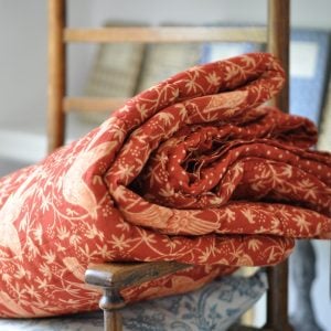 Songbird Quilted Throw in Red Madder
